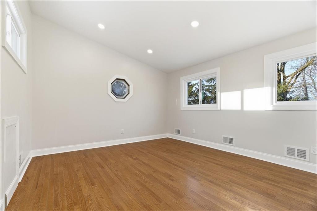 84 Hall Avenue Pittsburgh, PA 15205 - Photo 17 of 34 a view of empty room with wooden floor and fan