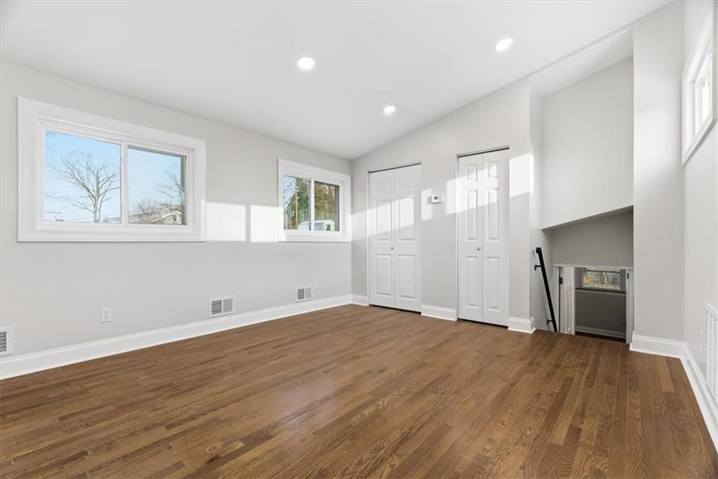 84 Hall Avenue Pittsburgh, PA 15205 - Photo 18 of 34 an empty room with wooden floor and windows