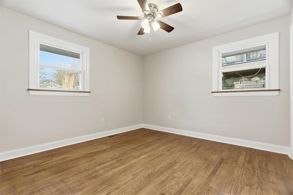 84 Hall Avenue Pittsburgh, PA 15205 - Photo 19 of 34 a view of an empty room with wooden floor and a ceiling fan