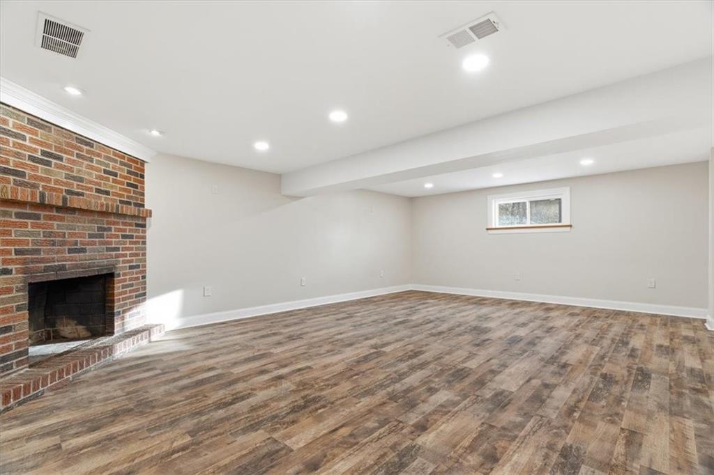 84 Hall Avenue Pittsburgh, PA 15205 - Photo 22 of 34 a view of empty room with wooden floor and fireplace
