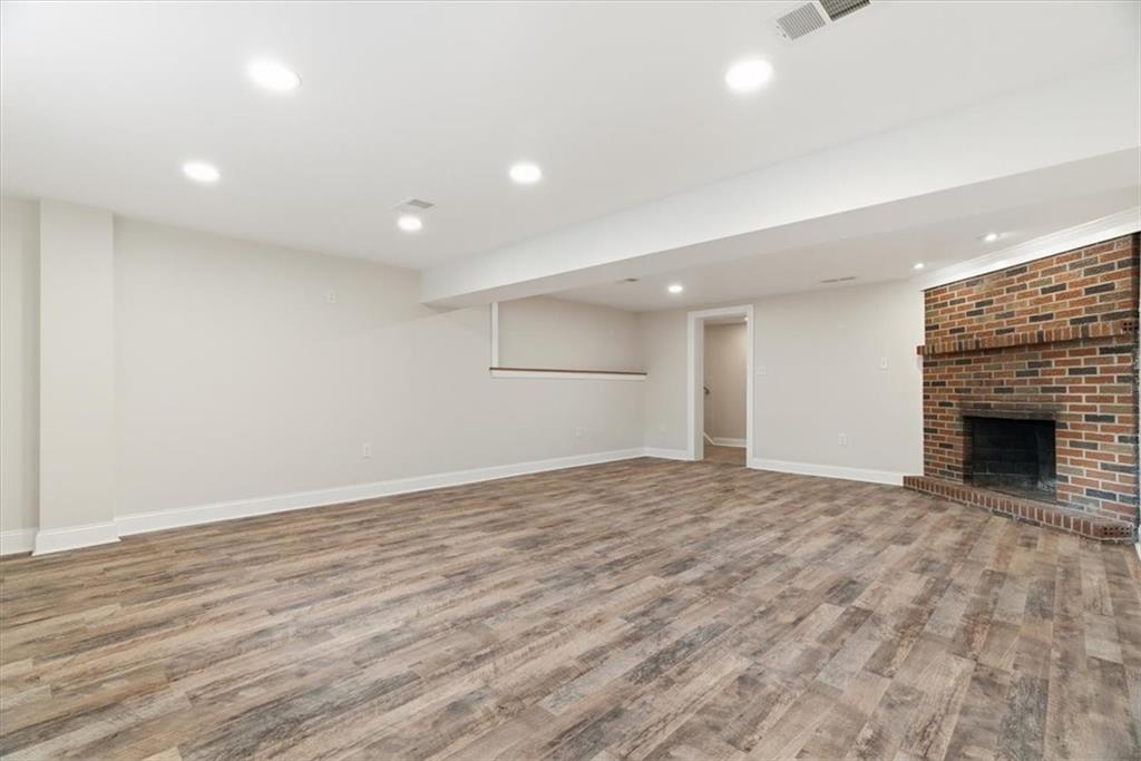 84 Hall Avenue Pittsburgh, PA 15205 - Photo 23 of 34 a view of an empty room with wooden floor fireplace and a window