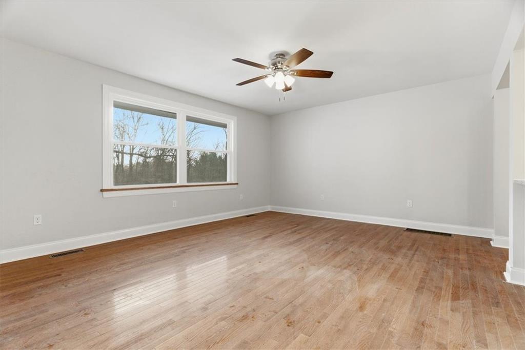 84 Hall Avenue Pittsburgh, PA 15205 - Photo 5 of 34 a view of an empty room with wooden floor and a window