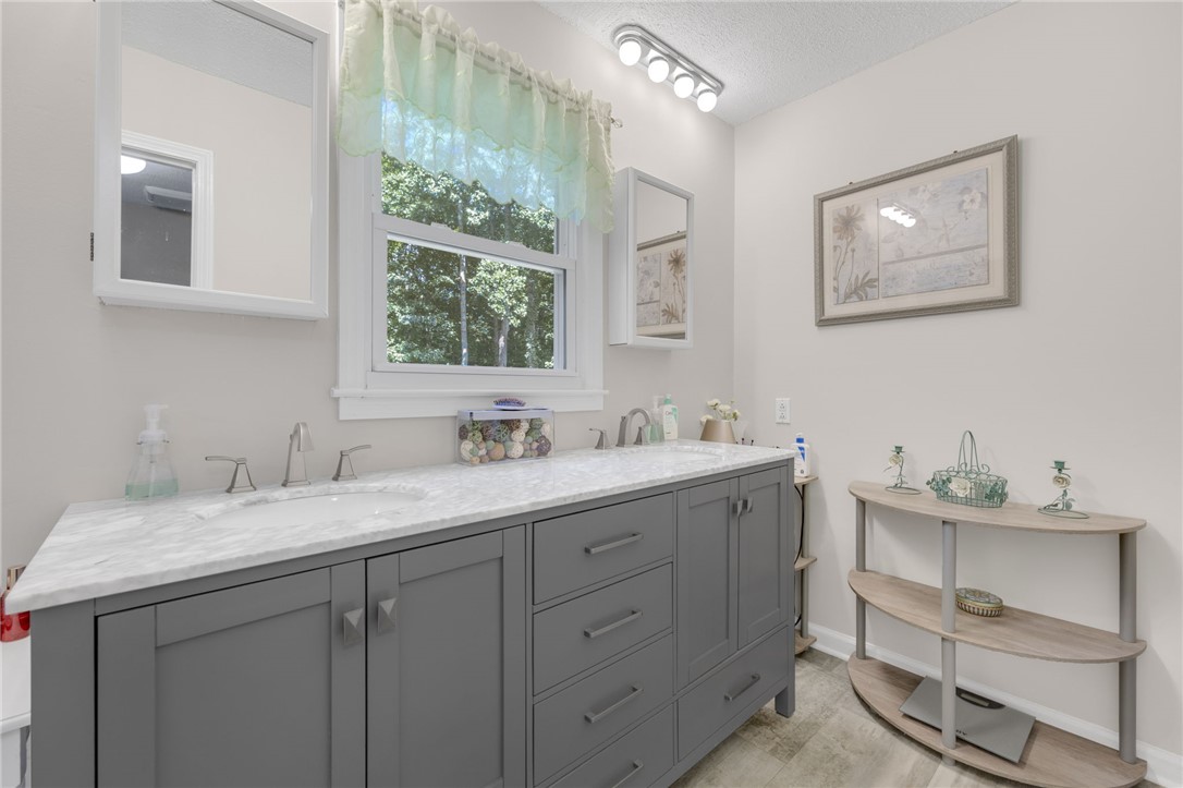 250 Rockcrest Road Cleveland, SC 29635 - Photo 21 of 37 A well-appointed bathroom features a spacious double vanity with a marble countertop and ample storage.