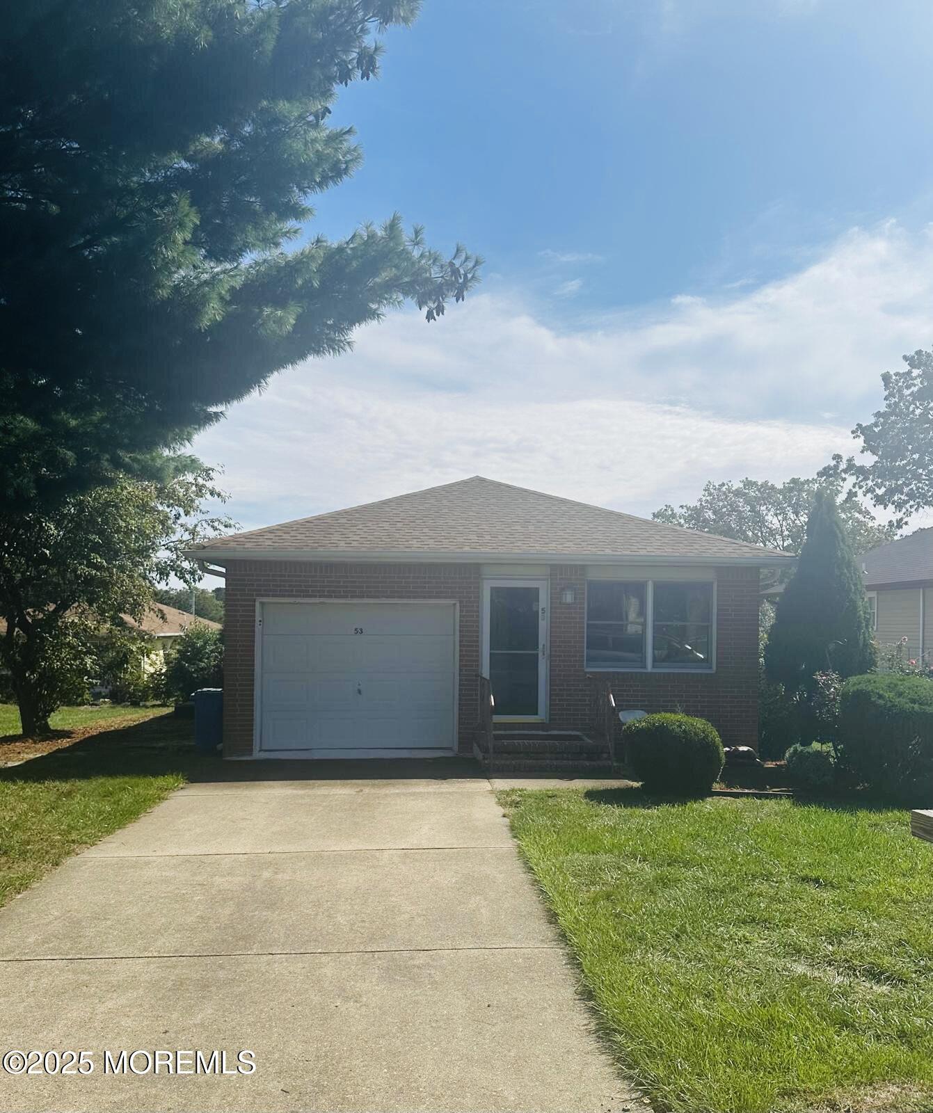 53 Sycamore Access Road Manahawkin, NJ 08050 - Photo 1 of 39 a front view of house with yard and green space