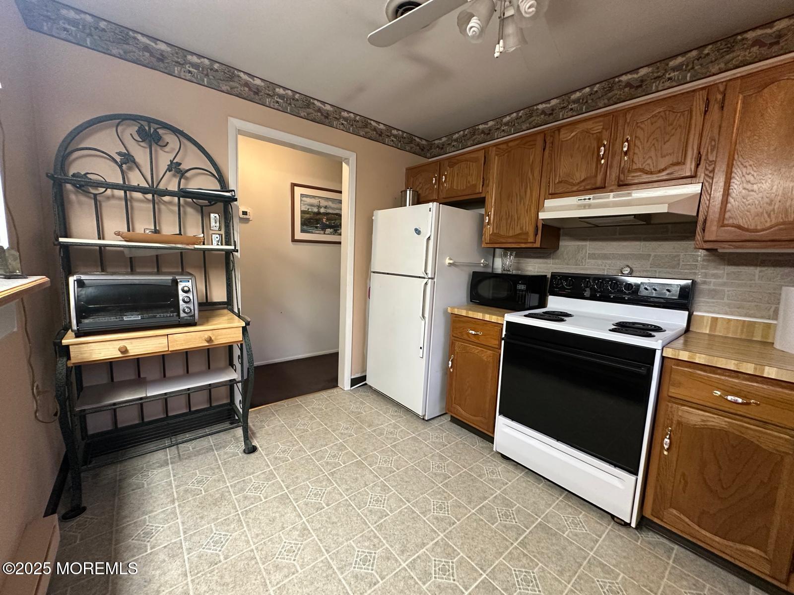 53 Sycamore Access Road Manahawkin, NJ 08050 - Photo 11 of 39 a utility room with dryer and washer