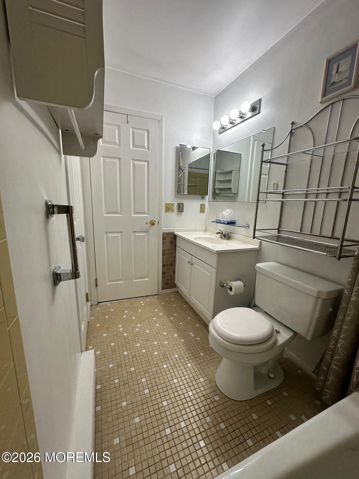 53 Sycamore Access Road Manahawkin, NJ 08050 - Photo 17 of 34 a bathroom with a sink toilet and shower