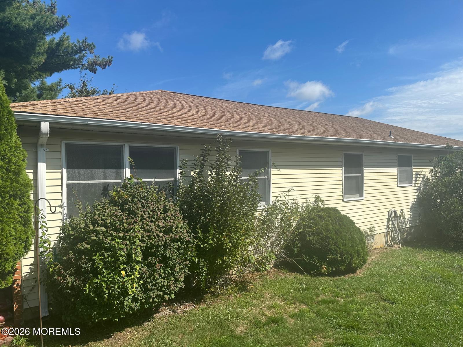53 Sycamore Access Road Manahawkin, NJ 08050 - Photo 20 of 34 a view of a house with a backyard