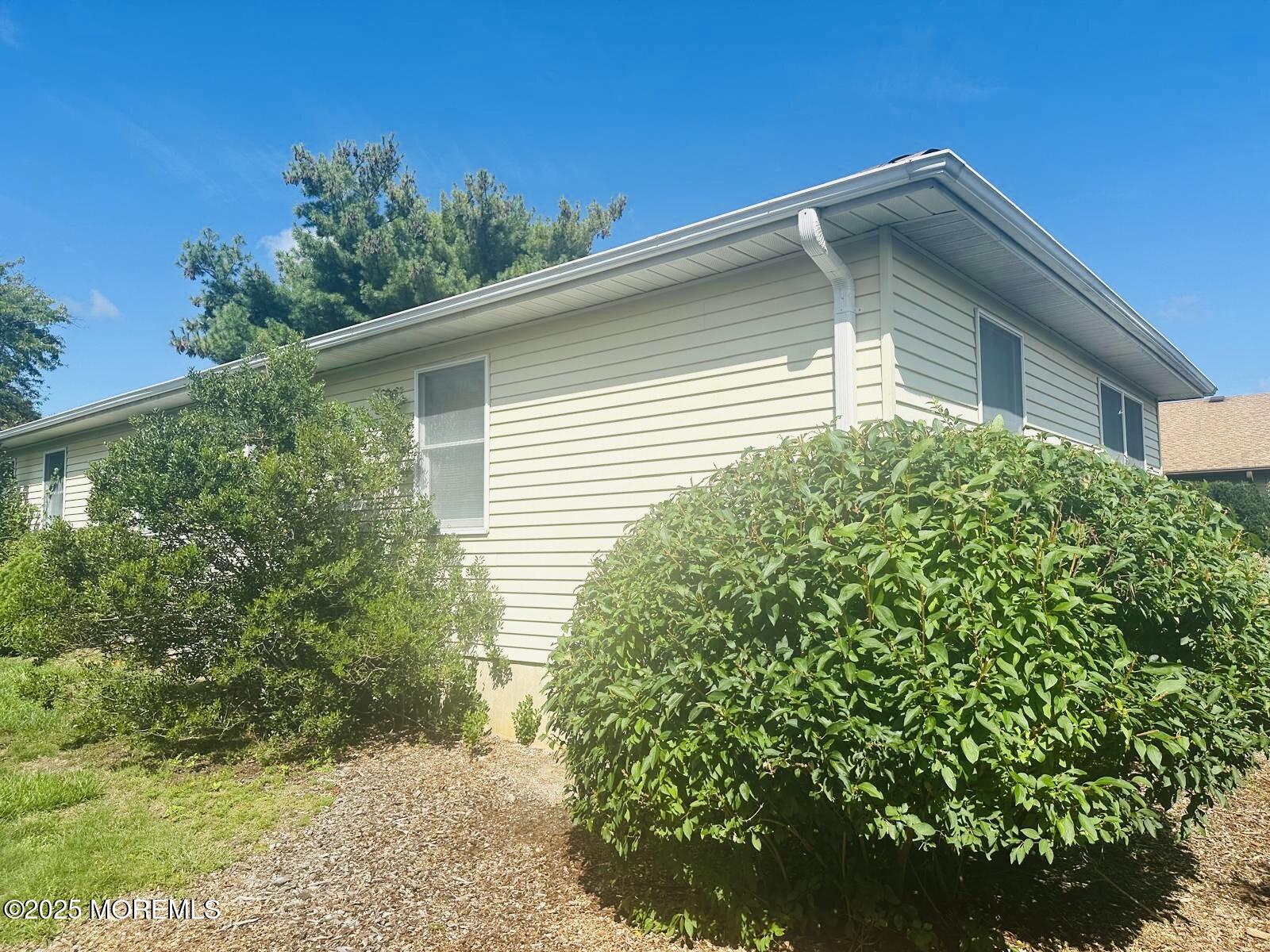 53 Sycamore Access Road Manahawkin, NJ 08050 - Photo 3 of 39 a front view of a house with a yard