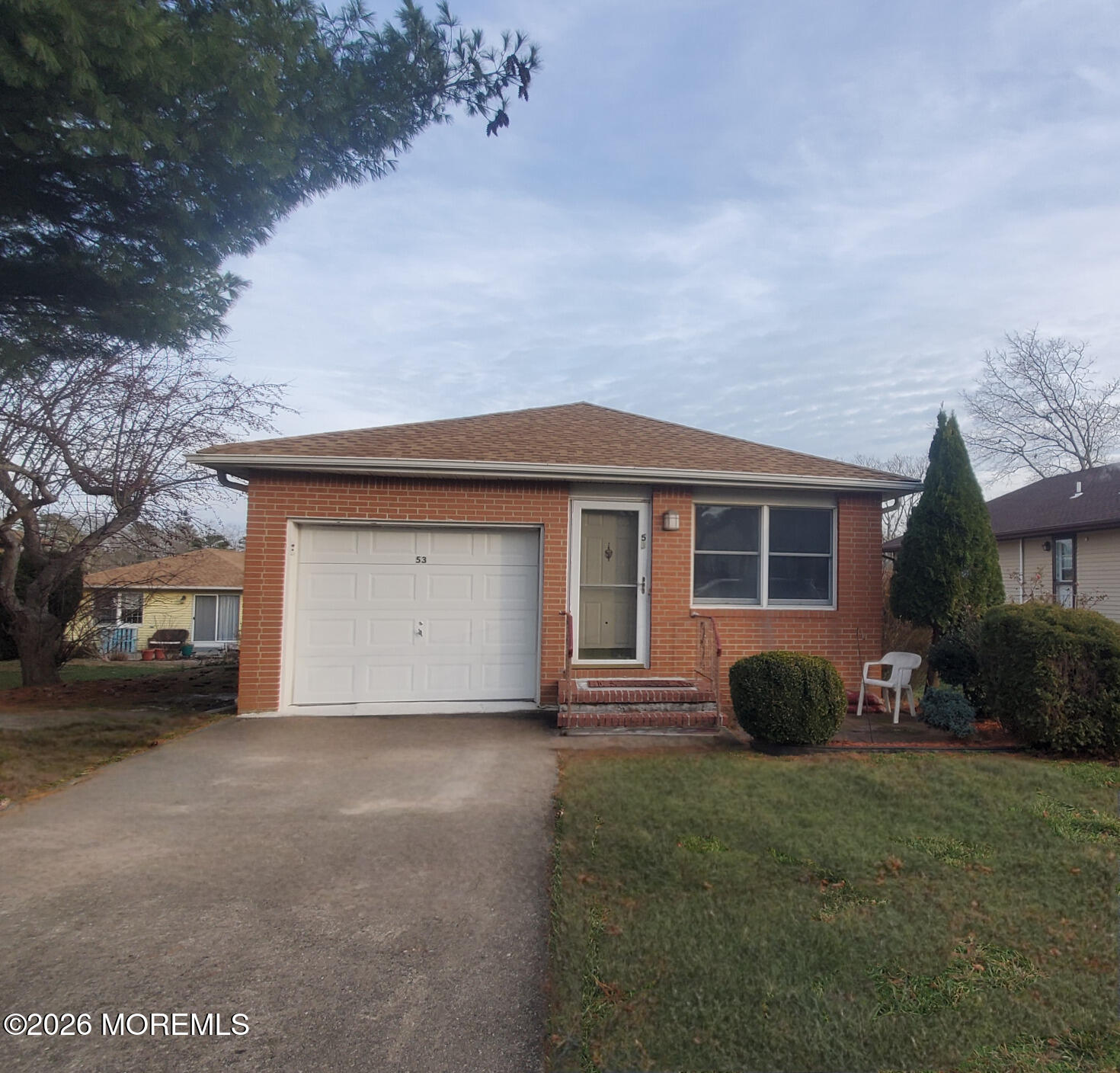 53 Sycamore Access Road Manahawkin, NJ 08050 - Photo 32 of 34 a front view of a house with a garden