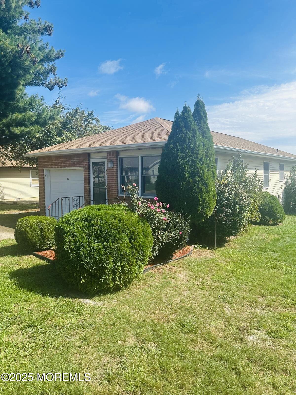 53 Sycamore Access Road Manahawkin, NJ 08050 - Photo 37 of 39 a view of a house with a garden