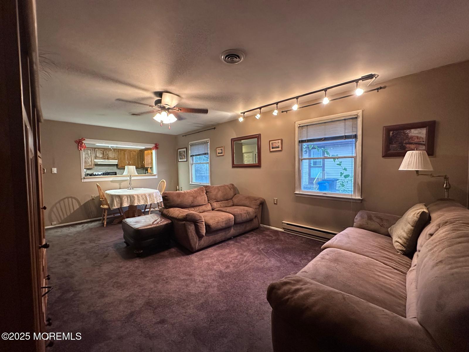53 Sycamore Access Road Manahawkin, NJ 08050 - Photo 10 of 39 a living room with furniture chess board and a window