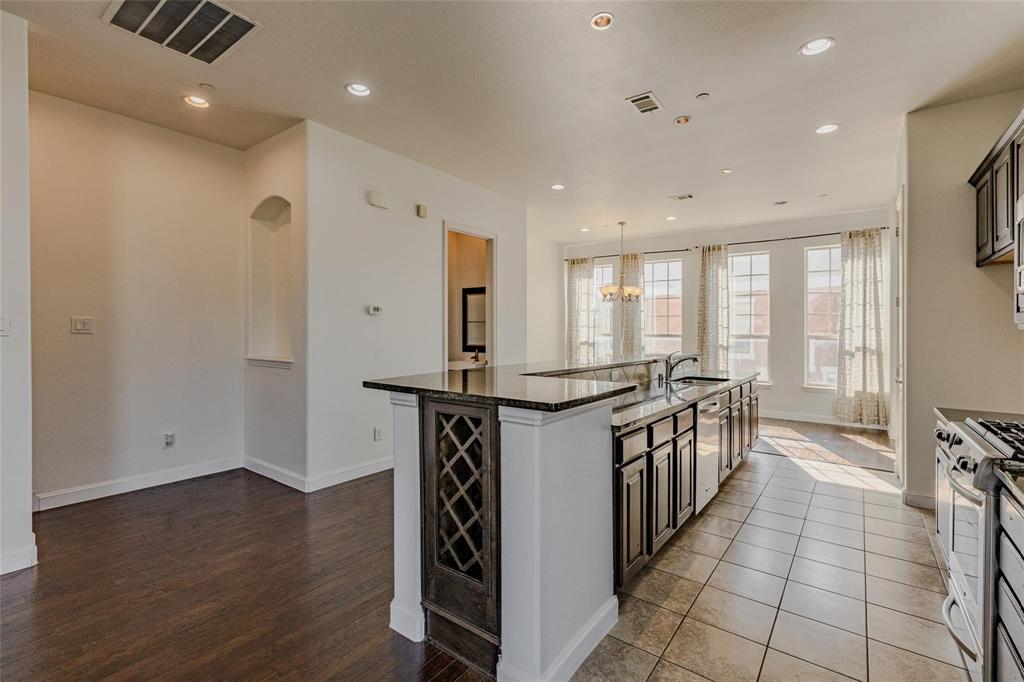 602 Arbol Irving, TX 75039 - Photo 11 of 38 a kitchen with stainless steel appliances a stove top oven a sink and a refrigerator