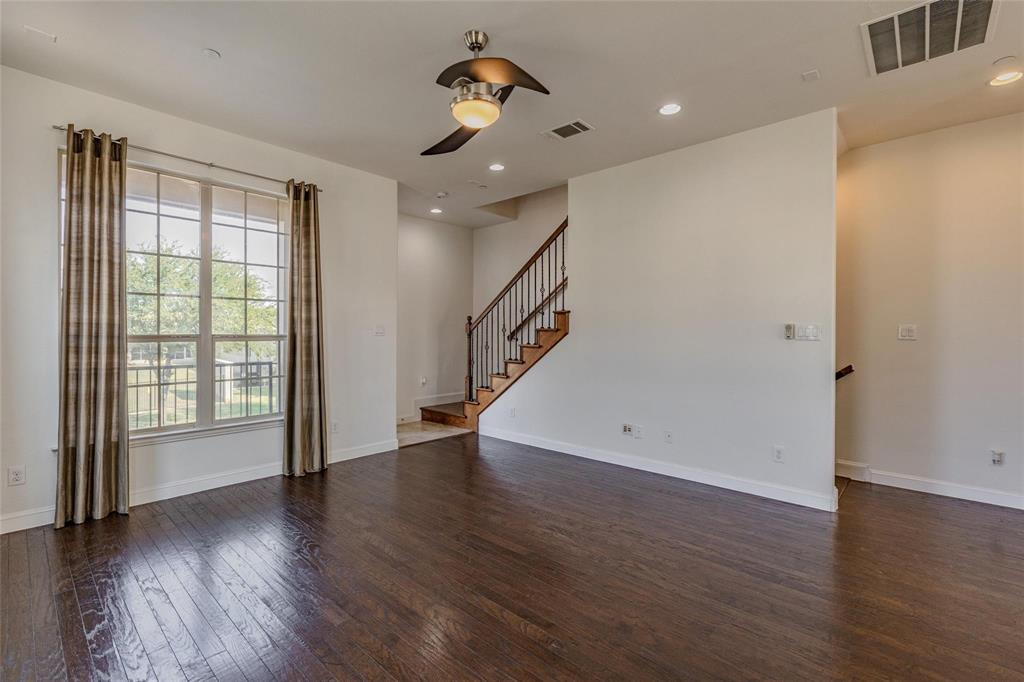 602 Arbol Irving, TX 75039 - Photo 12 of 38 wooden floor in an empty room with a window