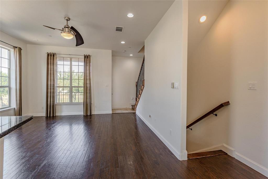 602 Arbol Irving, TX 75039 - Photo 13 of 38 wooden floor in an empty room with a window