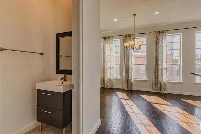 a bathroom with a sink a mirror and a shower