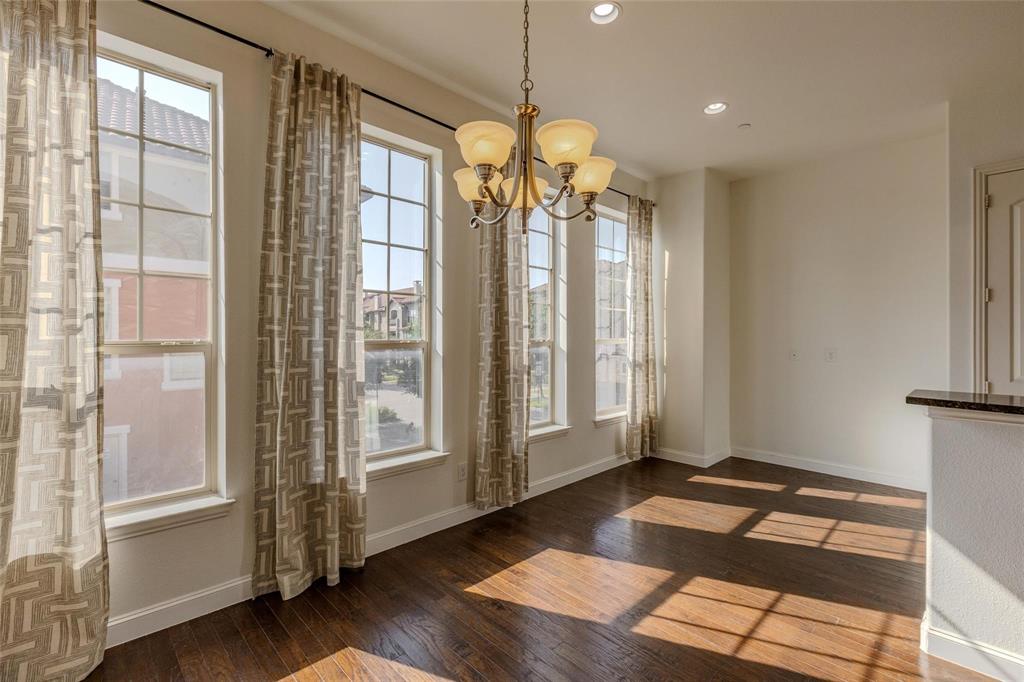 602 Arbol Irving, TX 75039 - Photo 19 of 38 a very nice looking room with wooden floor and windows