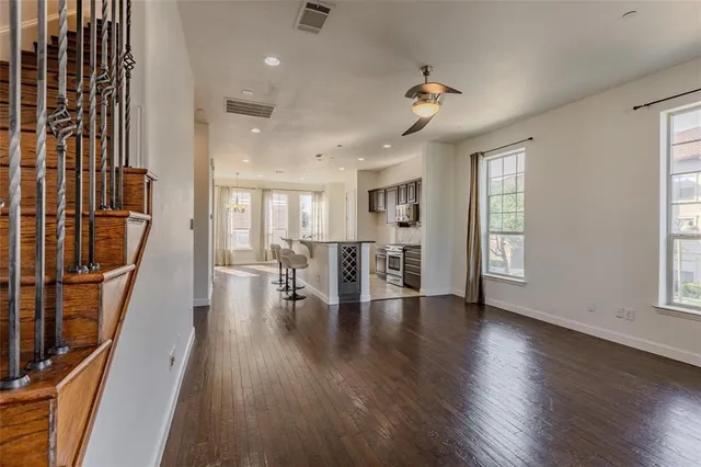 a view of dining room with furniture and wooden floor