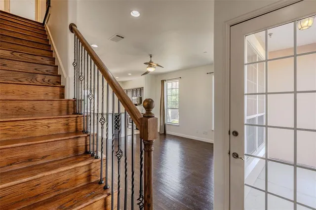 a view of entryway with wooden floor and stairs