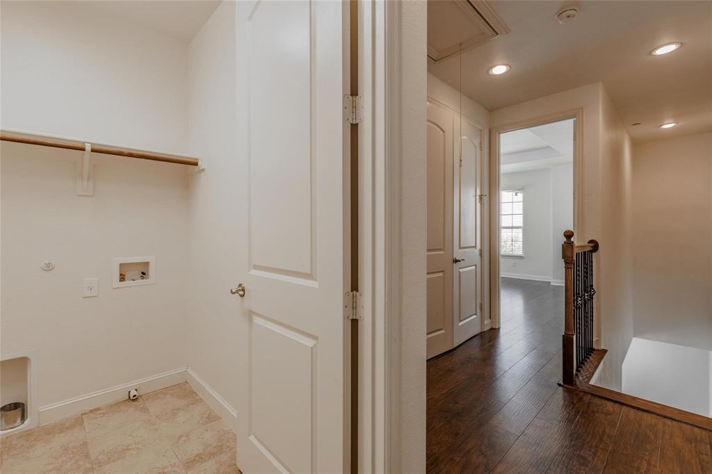 602 Arbol Irving, TX 75039 - Photo 22 of 38 a view of a hallway with wooden floor