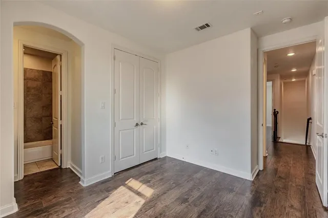 a view of hallway with a hallway and wooden floor