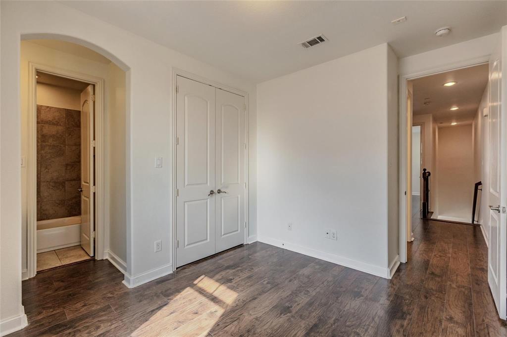 602 Arbol Irving, TX 75039 - Photo 24 of 38 a view of hallway with a hallway and wooden floor