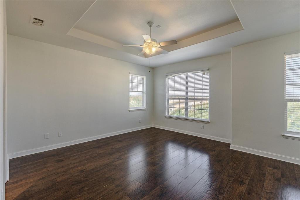 602 Arbol Irving, TX 75039 - Photo 26 of 38 a view of an empty room with wooden floor and a window