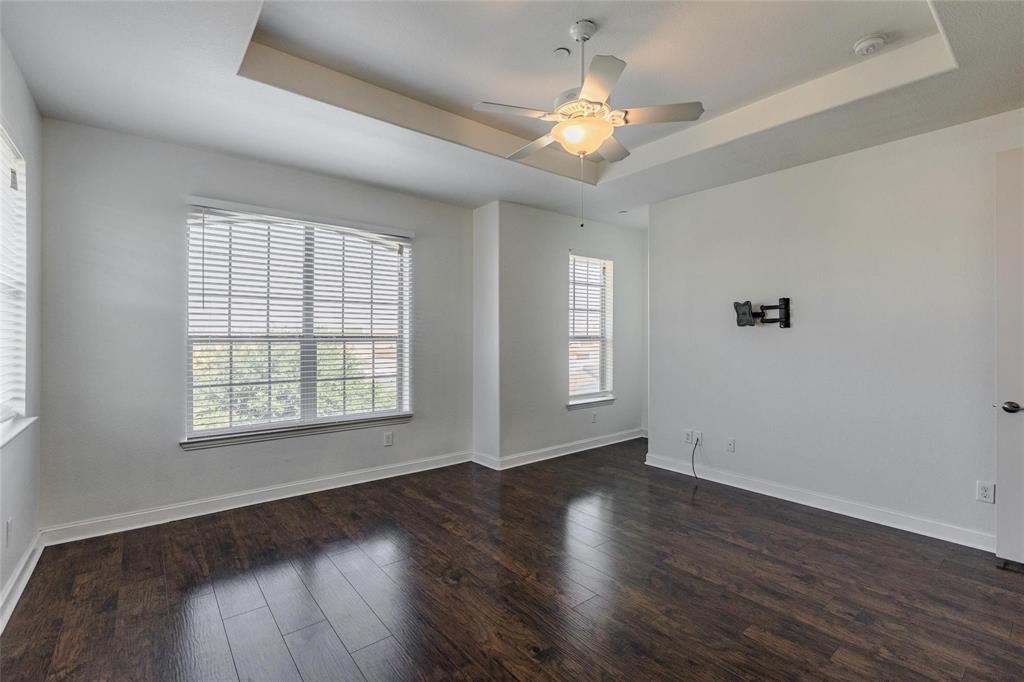 602 Arbol Irving, TX 75039 - Photo 27 of 38 a view of an empty room with wooden floor and a window