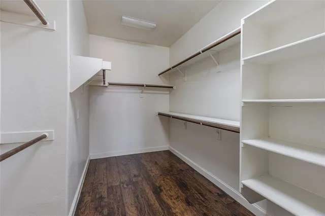 a view of an empty walk in closet