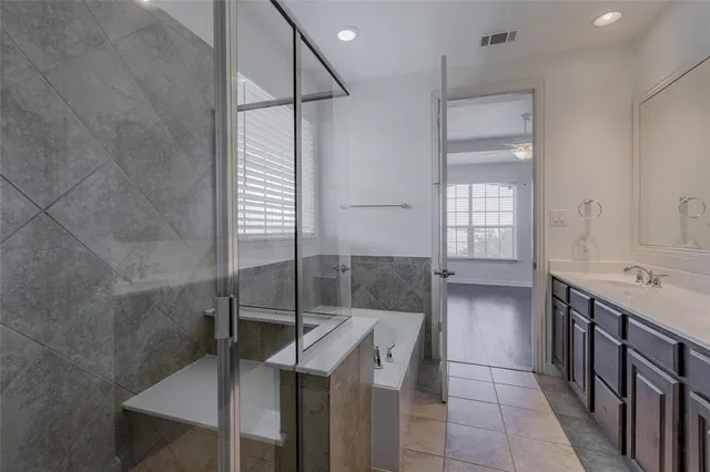 a bathroom with a shower and a sink