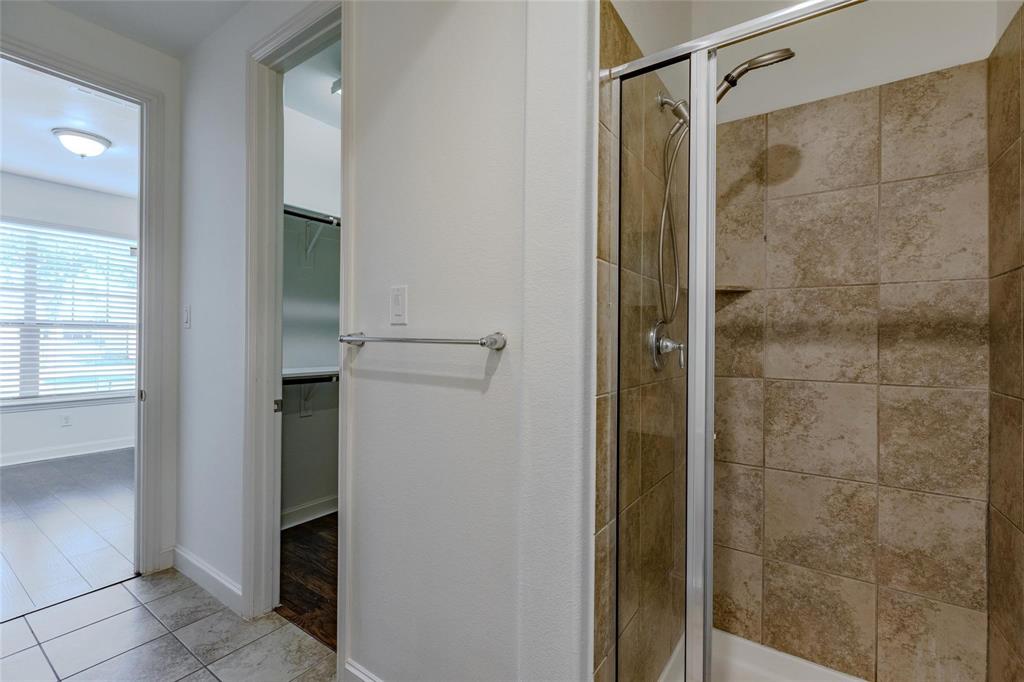602 Arbol Irving, TX 75039 - Photo 7 of 38 a bathroom with a shower