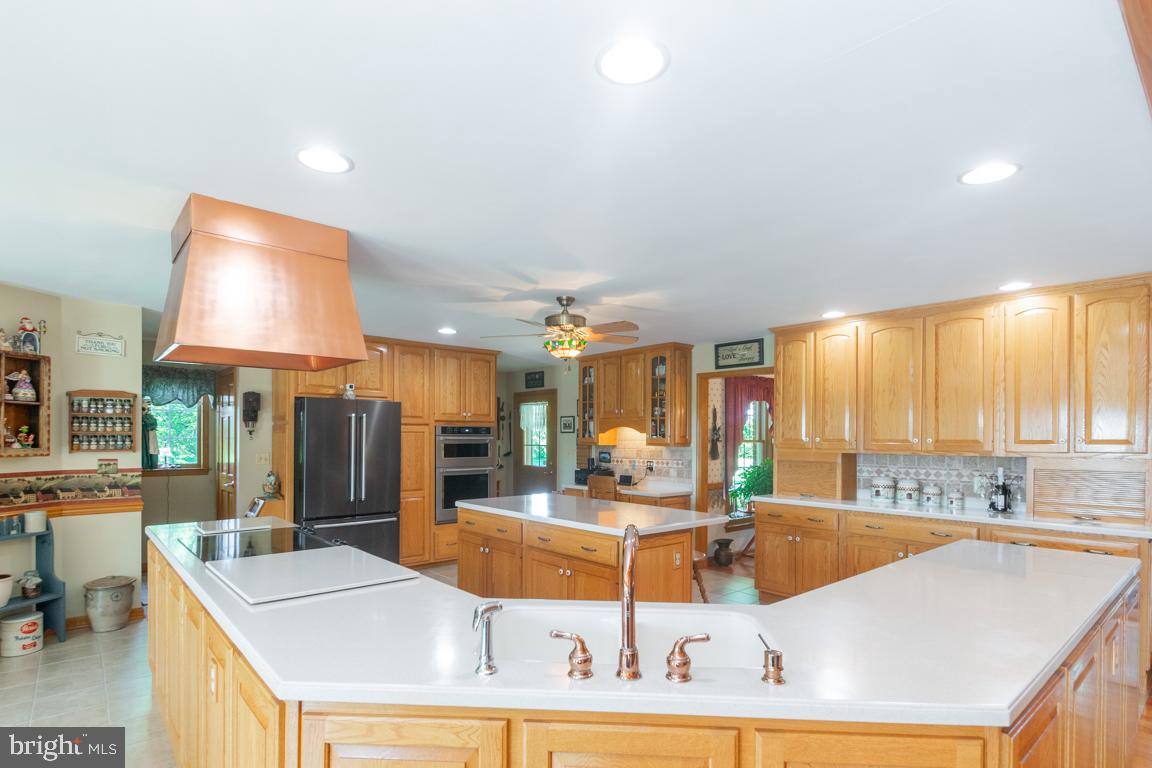613 Hanover Pike Hampstead, MD 21074 - Photo 16 of 55 a large kitchen with kitchen island granite countertop a large window and a sink