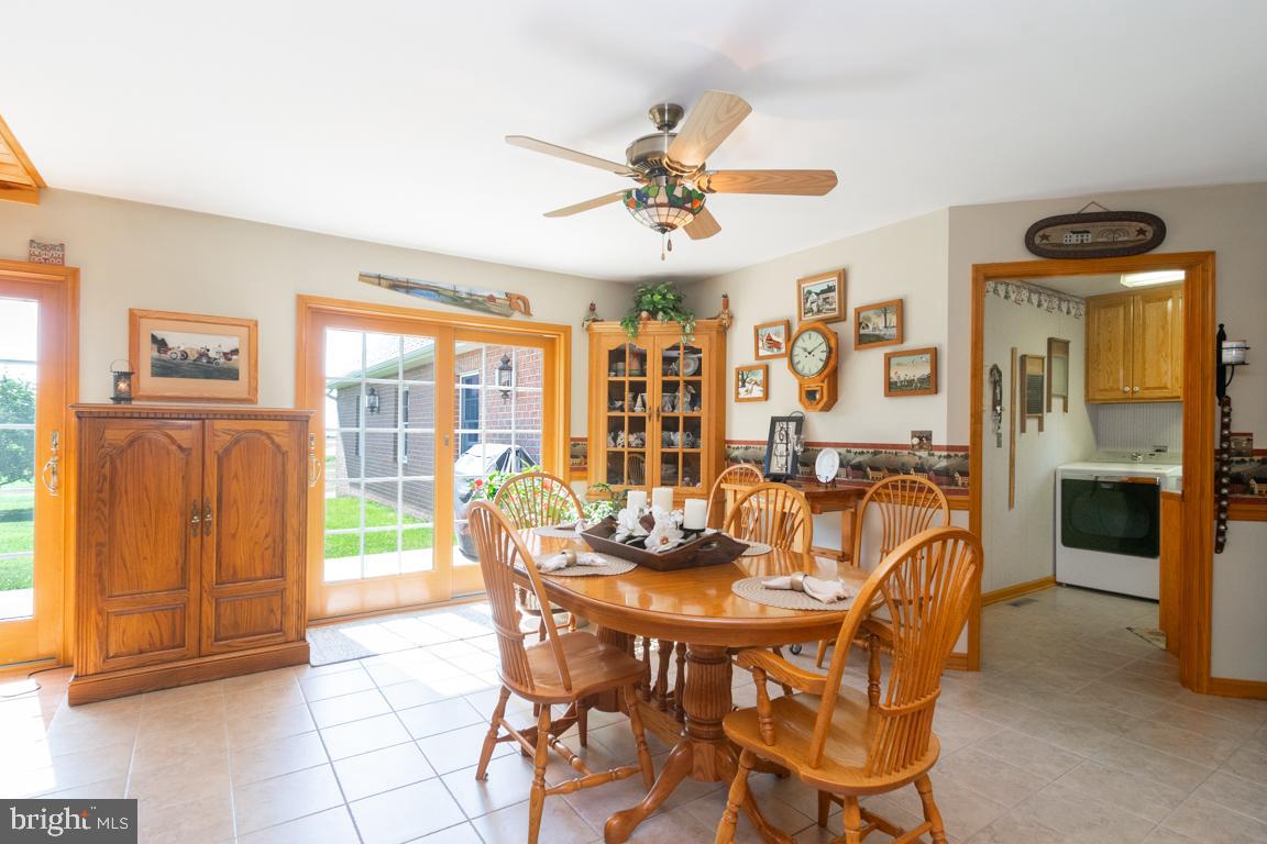 613 Hanover Pike Hampstead, MD 21074 - Photo 18 of 55 a view of a dining room with furniture window and outside view
