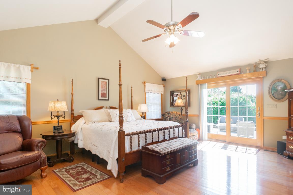613 Hanover Pike Hampstead, MD 21074 - Photo 24 of 55 a bedroom with a bed couch and a large window with outer view