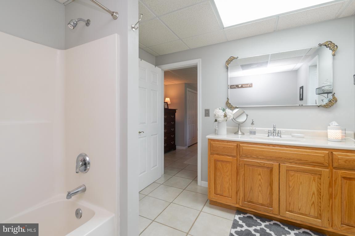613 Hanover Pike Hampstead, MD 21074 - Photo 40 of 55 a bathroom with a tub sink and mirror