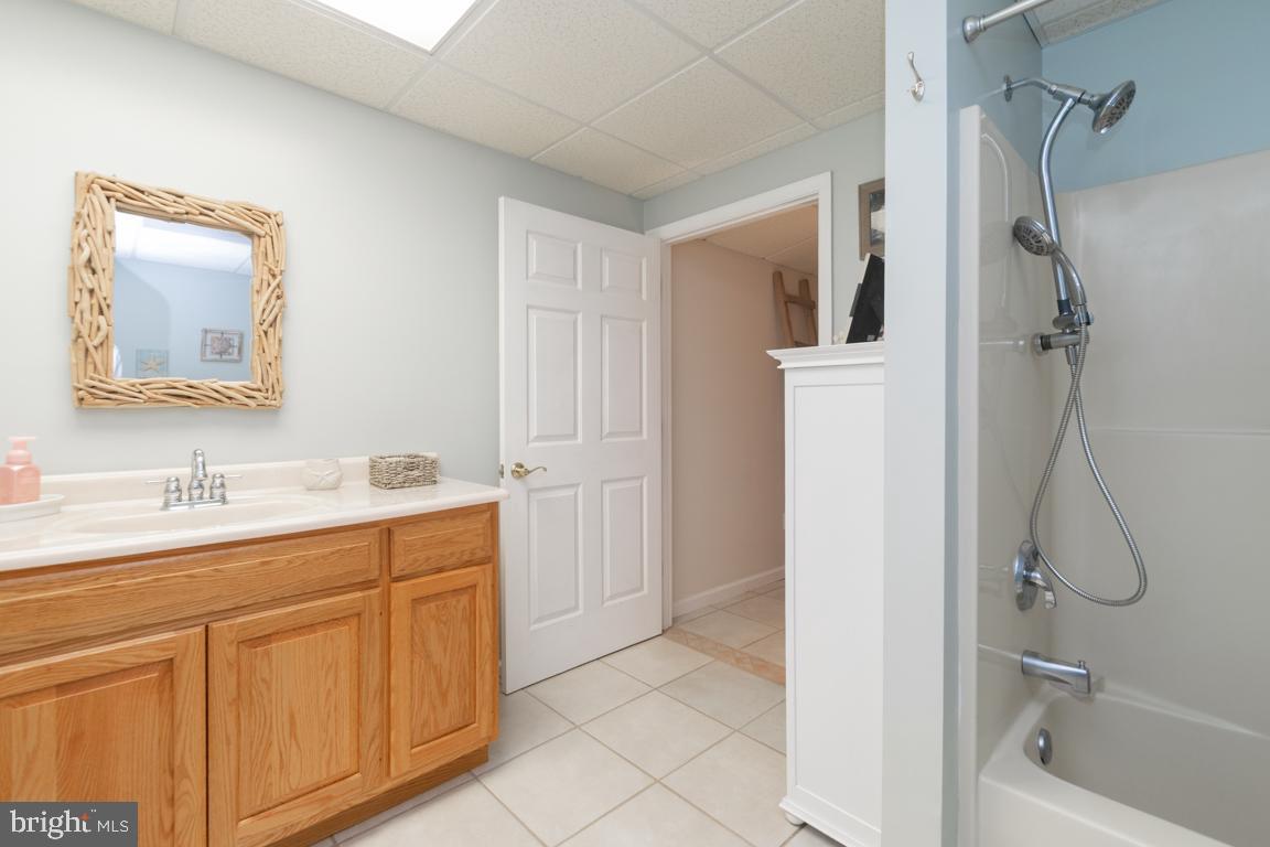 613 Hanover Pike Hampstead, MD 21074 - Photo 41 of 55 a bathroom with a granite countertop sink mirror and shower