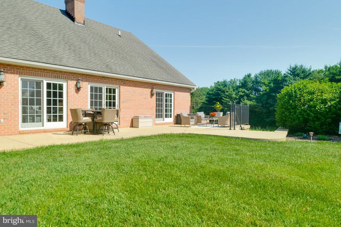 613 Hanover Pike Hampstead, MD 21074 - Photo 50 of 55 a view of a house with a backyard and a patio