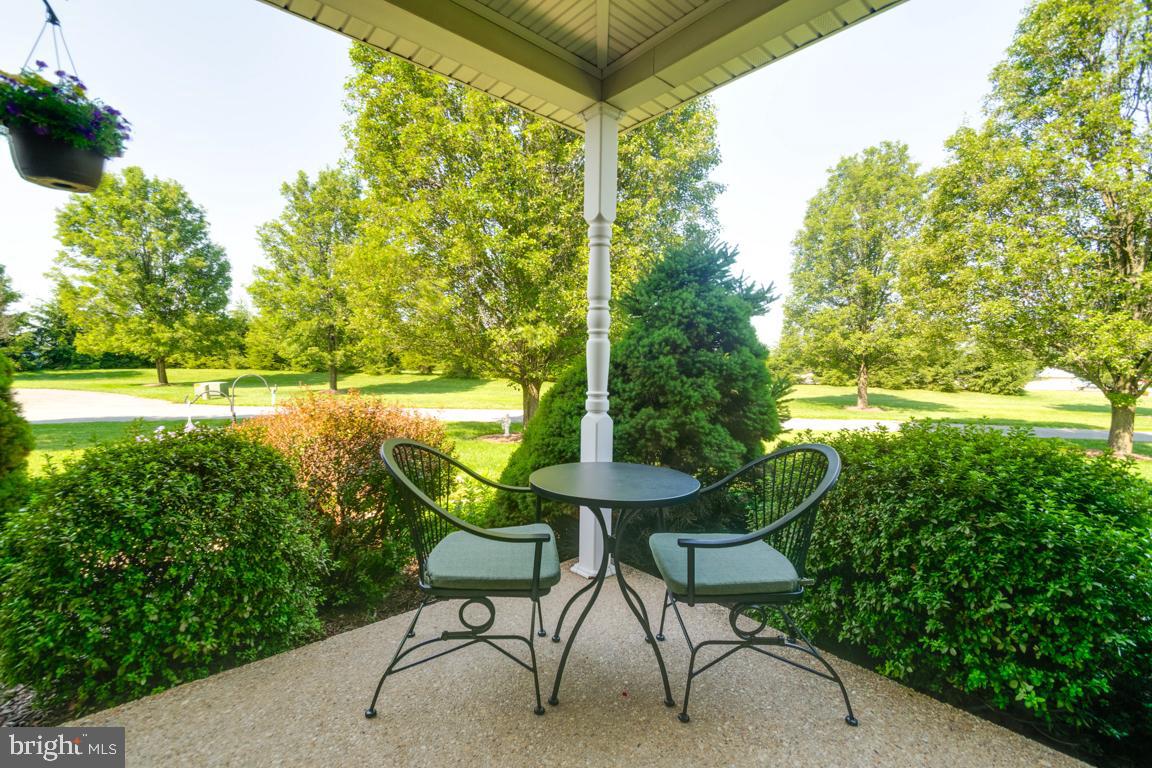 613 Hanover Pike Hampstead, MD 21074 - Photo 5 of 55 a view of chair and table in the garden