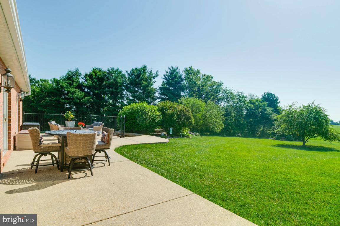 613 Hanover Pike Hampstead, MD 21074 - Photo 51 of 55 a white bench sitting in the grass near a yard