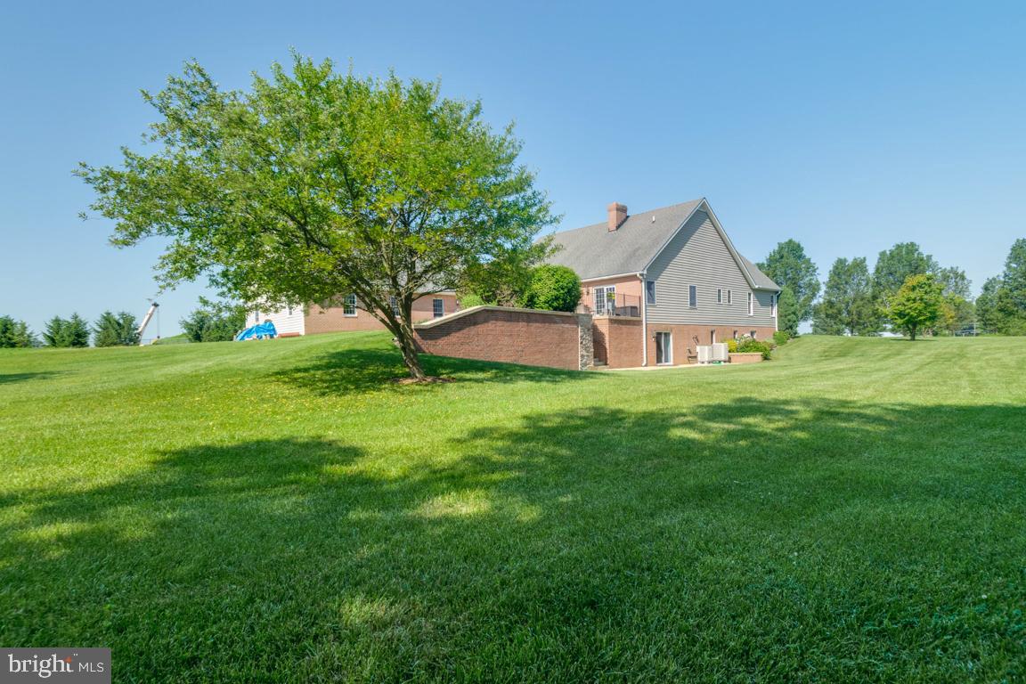 613 Hanover Pike Hampstead, MD 21074 - Photo 53 of 55 a front view of a house with garden