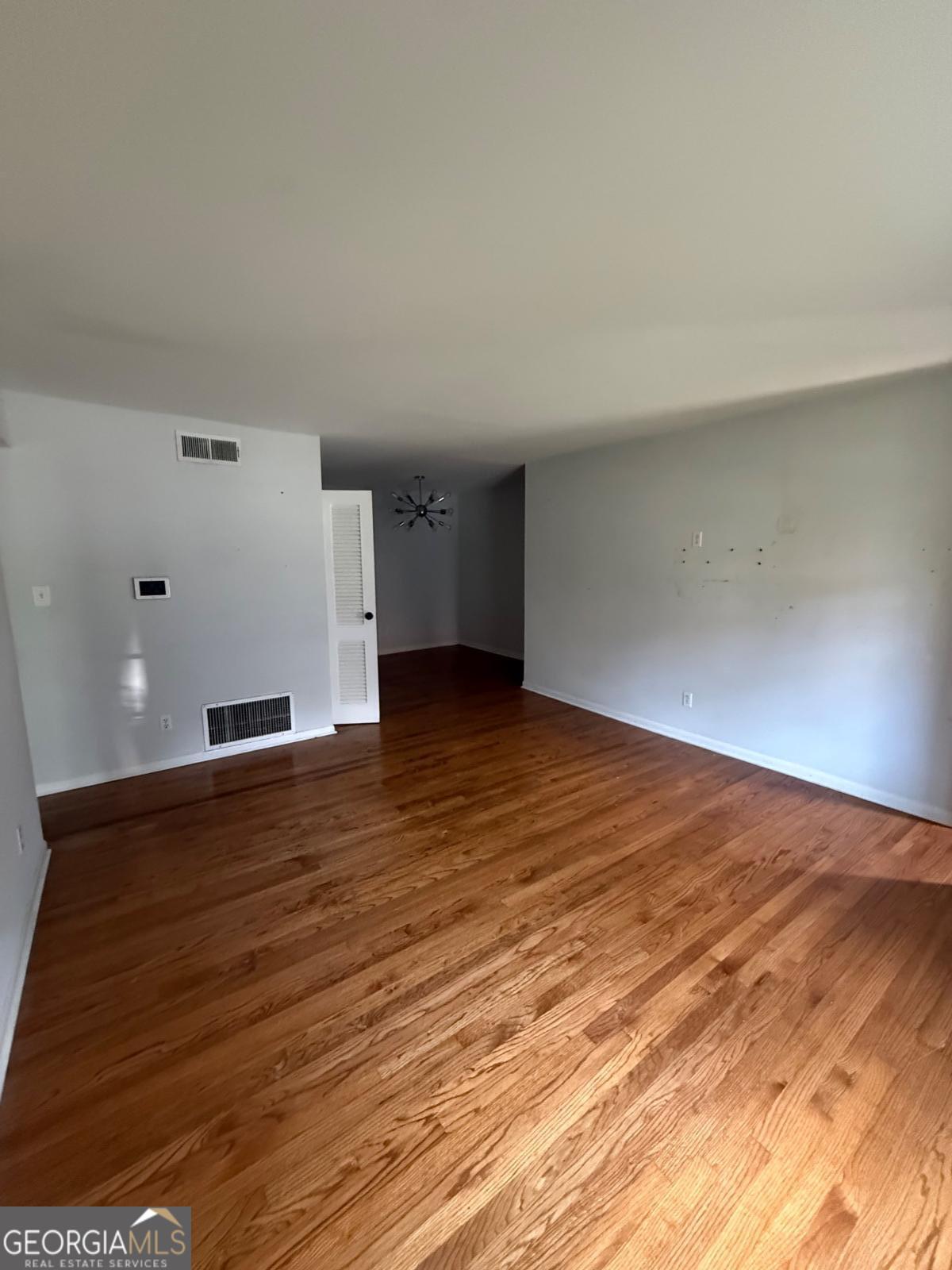 3510 Roswell Road, Unit H1 Atlanta, GA 30326 - Photo 12 of 43 a view of empty room with wooden floor