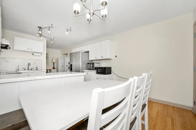 a kitchen with a sink a stove and cabinets