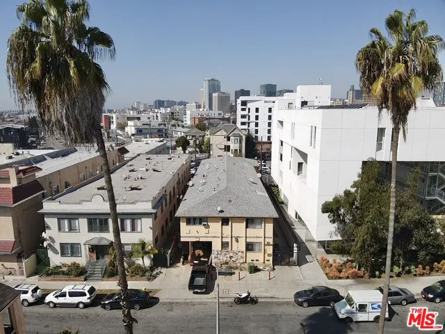 a front view of a house with many windows