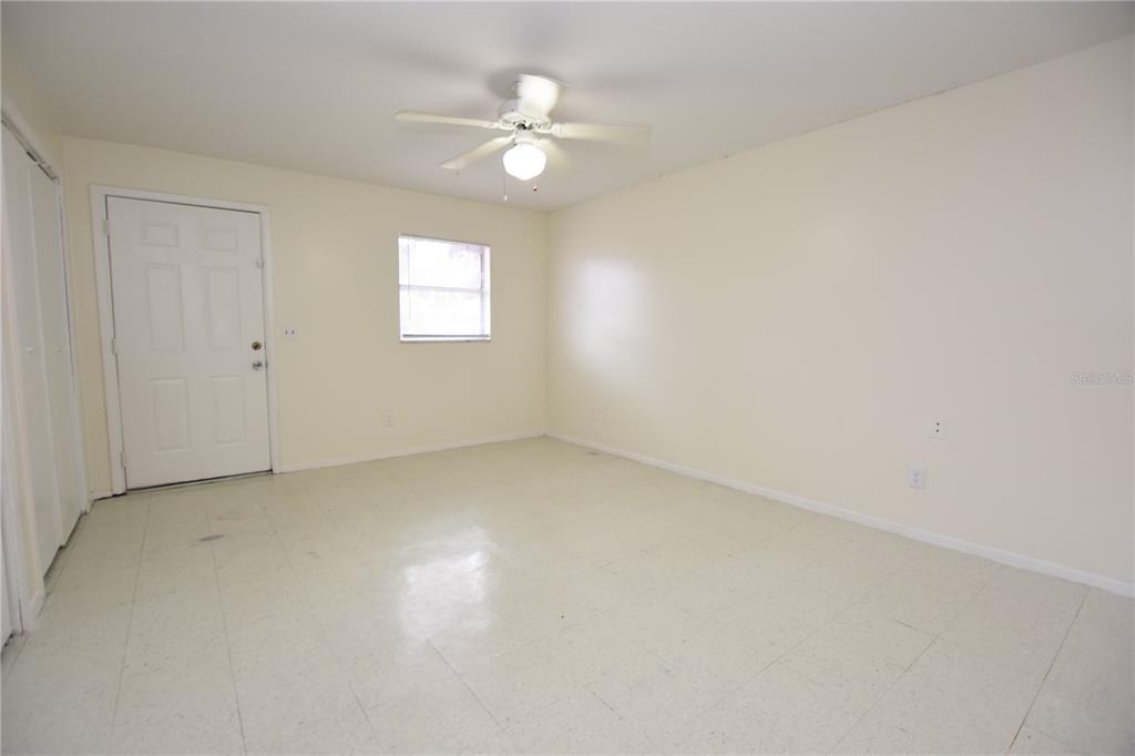619 Robin Road, Unit 3 Lakeland, FL 33803 - Photo 12 of 17 an empty room with a window