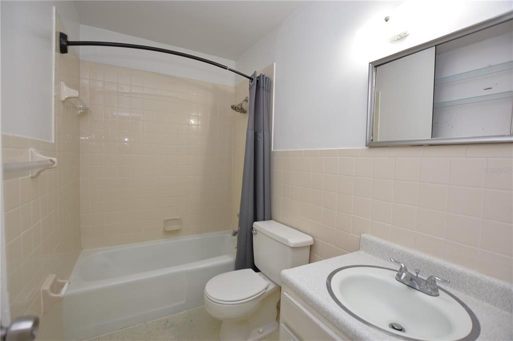 619 Robin Road, Unit 3 Lakeland, FL 33803 - Photo 14 of 17 a bathroom with a sink toilet and shower