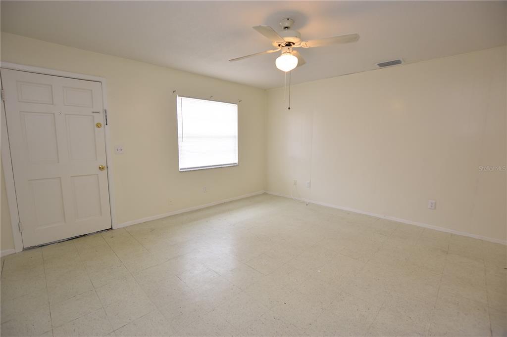 619 Robin Road, Unit 3 Lakeland, FL 33803 - Photo 10 of 17 an empty room with windows and fan