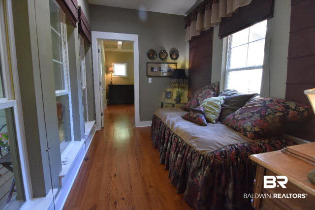 13848 Elmwood Court Stapleton, AL 36578 - Photo 10 of 27 Relax and read a book in this cozy keeping room just off the master suite. This sunny room has a view of screened porch and pool area. Could also be used as an extra sleeping area or small nursery.
