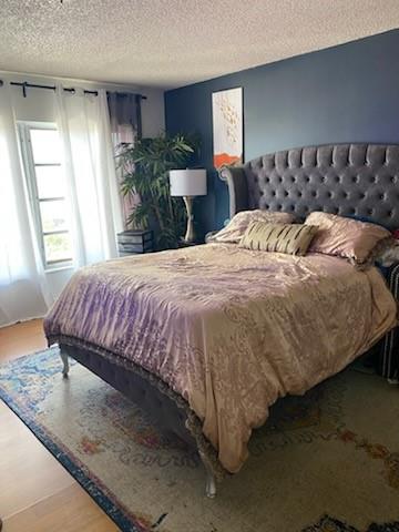 4174 Inverrary Drive, Unit 1015 Lauderhill, FL 33319 - Photo 11 of 15 a bedroom with a bed and window