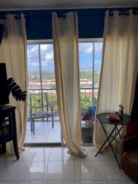 4174 Inverrary Drive, Unit 1015 Lauderhill, FL 33319 - Photo 14 of 15 a living room with furniture and a window