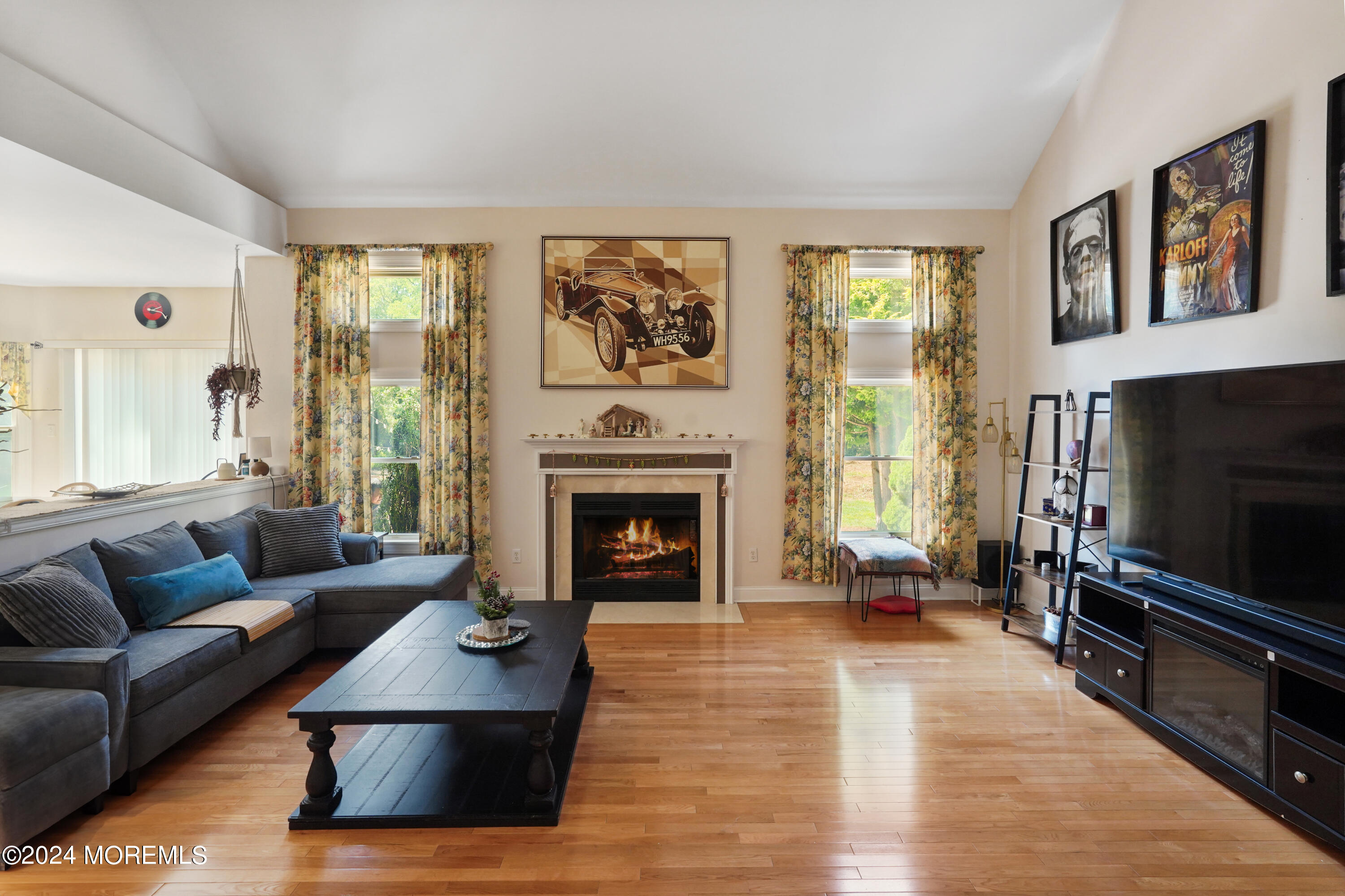 455 Iron Bridge Road Freehold, NJ 07728 - Photo 14 of 60 a living room with furniture flat screen tv and a fireplace