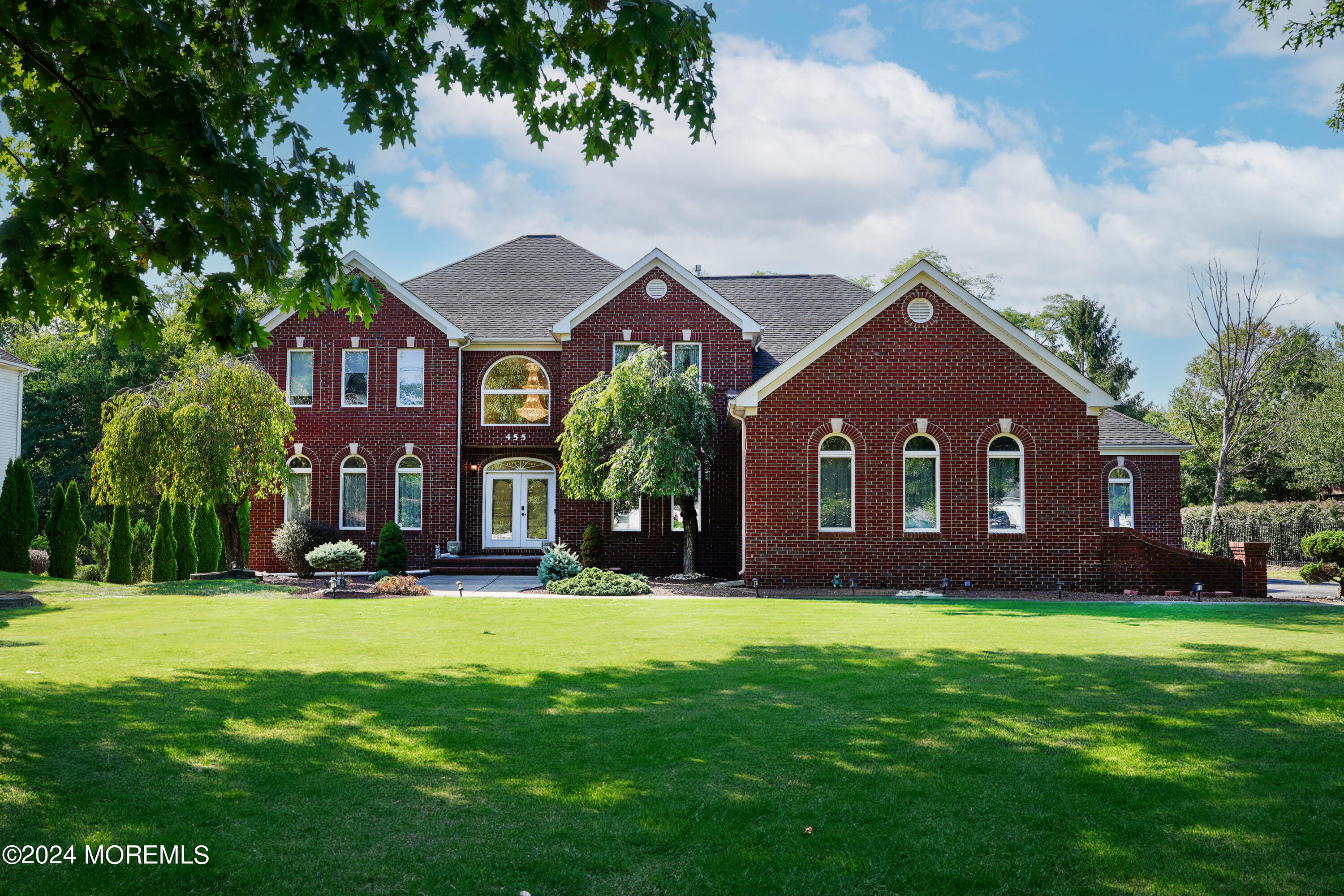455 Iron Bridge Road Freehold, NJ 07728 - Photo 2 of 60 a front view of a house with yard and green space